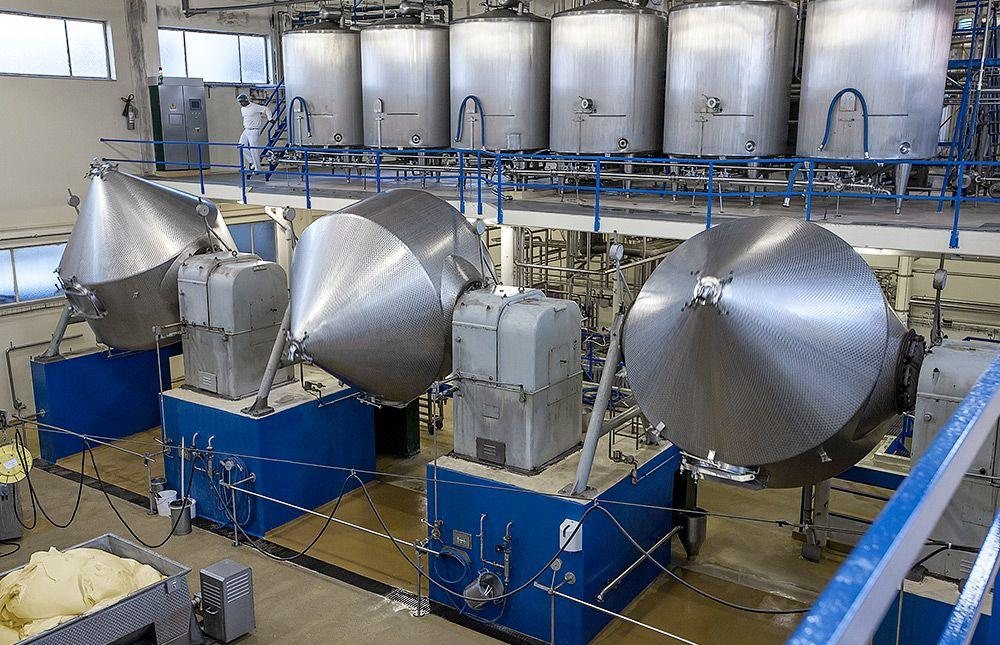 Butter churners and stainless steel process tanks in a dairy plant